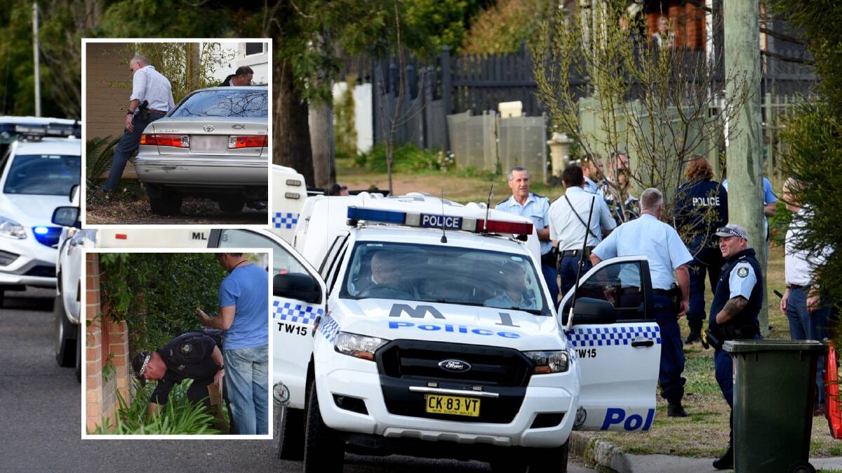 Eight years: Dozens of Oxley detectives and police in the Bligh and Marius Street area in Tamworth on August 11, last year, after they captured Robert Atkinson hiding in a garage. Photos: Gareth Gardner