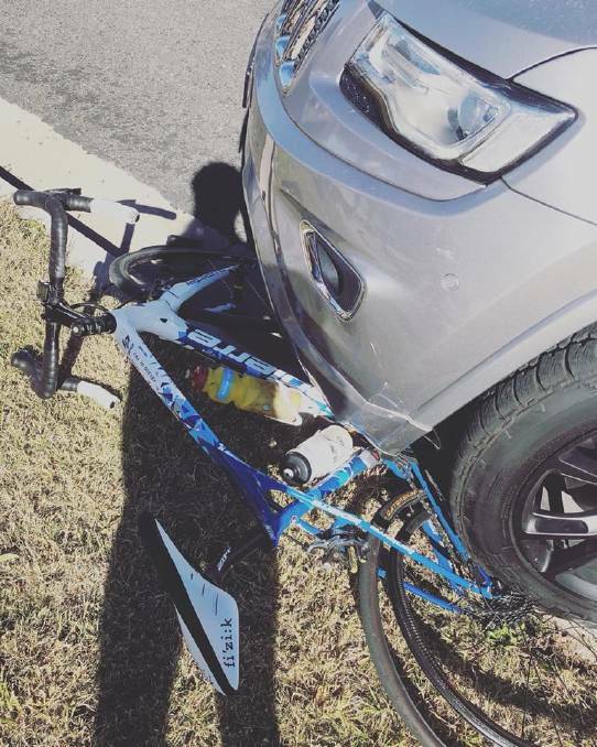 Crash scene: The bike under the car on Bundarra Road at Armidale in May. Photo: Supplied