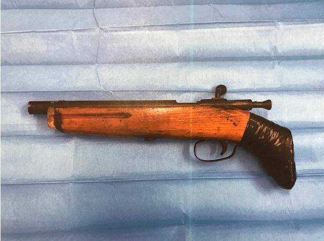 Seized: The prohibited .22 calibre sawn-off rifle that was allegedly found in a bedroom where Jake Carter was arrested in Armidale. Photo: NSW Police