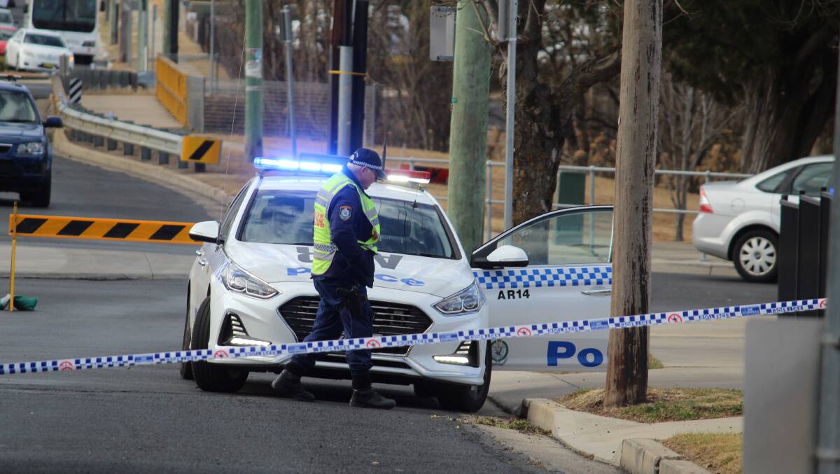 Crime scene: Police and detectives examine the roadway on Markham Street, Armidale, where the man was struck on Friday, August 9. Photo: Jann Karp