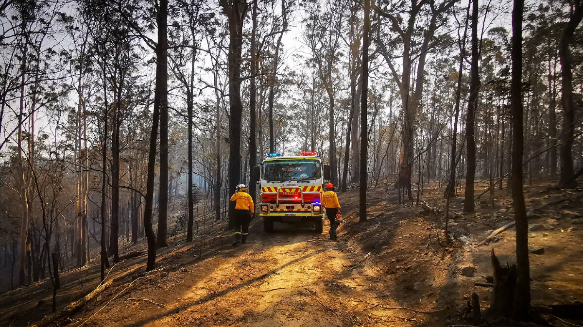 Total fire ban: Firefighters at the Long Gully Rd Fire, in northeast NSW, which has been contained. Photo: NSW RFS