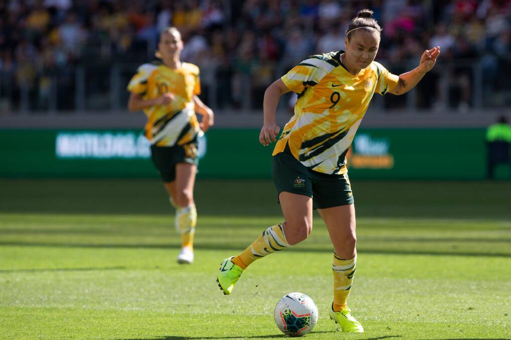 MOVING FORWARD: Caitlin Foord looks to pass the ball to a Matildas team mate during a match in November. Picture: Getty Images