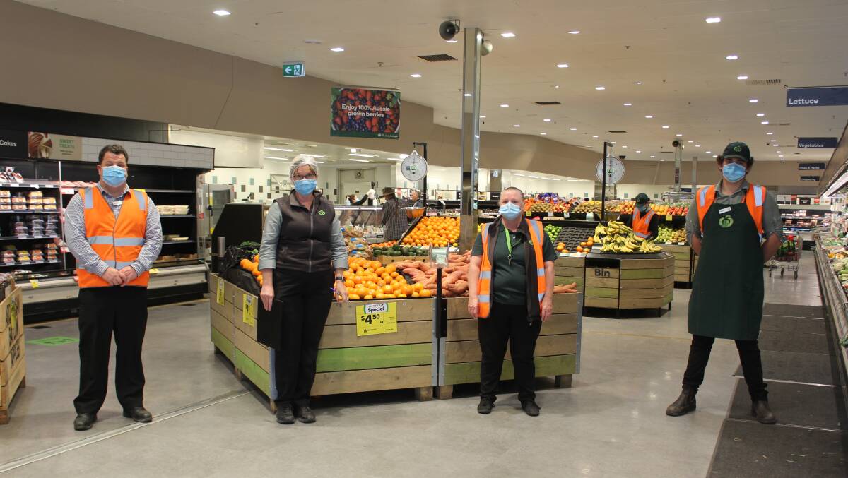 DOING THEIR BIT: Woolworths staff at Moree staff with face masks. Picture: Sophie Harris
