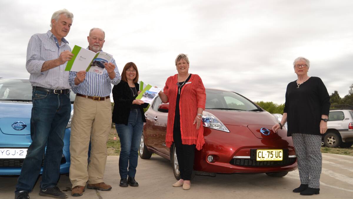 NEW DIRECTION: Councillor John Fry, Grant Christopherson from the Office of Environment and Heritage, Bathurst Community Climate Action Network president Tracy Sorensen, Cr Jacqui Rudge and Cr Monica Morse at the launch of the report into electric car racing at Mount Panorama. They are pictured with two Nissan Leafs.