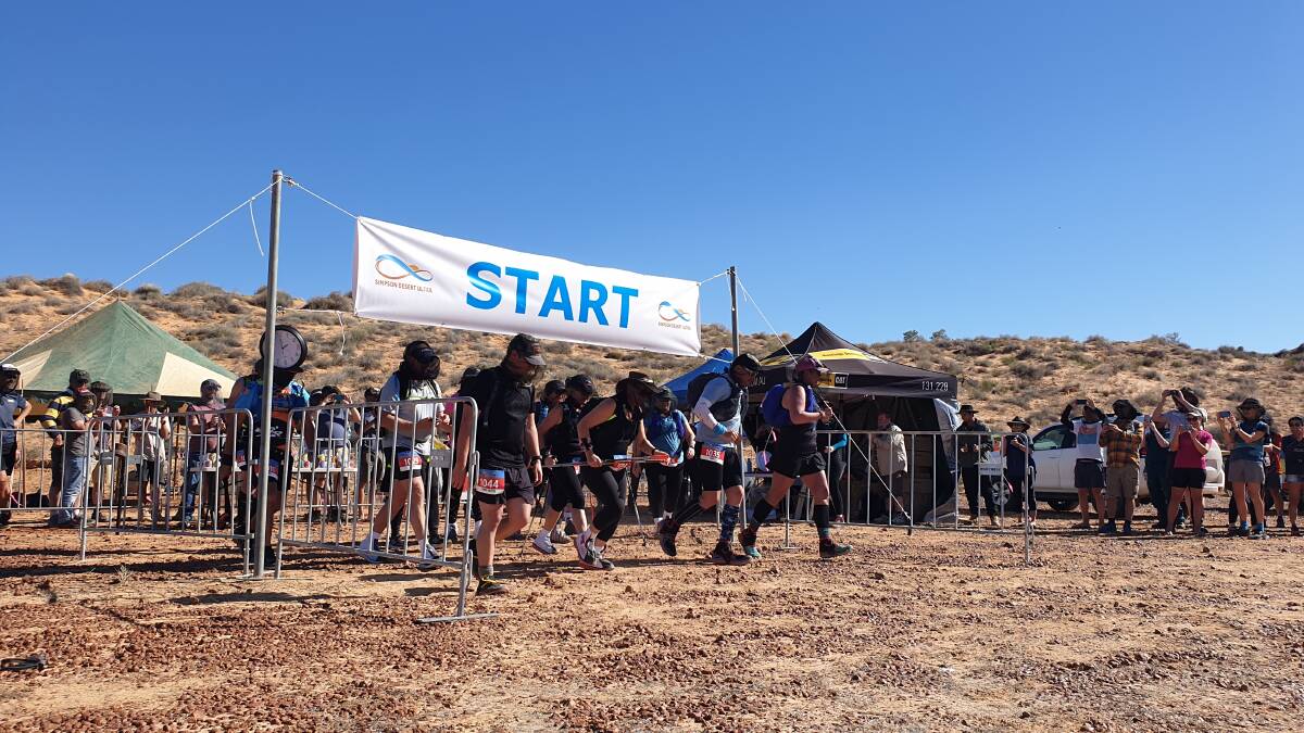 Some of the 100km ultra marathon runners leaving the Simpson Desert Ultra hub on Saturday afternoon. Photo - Sally Gall.