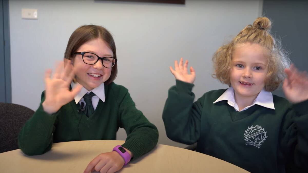 BUDDIES: St Mary of the Angels Primary School students Olive, from year four, has been tutoring Grace in her reading. Both appear on a film on inclusion. Photos: Supplied
