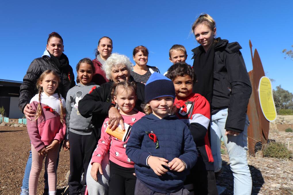 FAMILY: Priscila Harrison (centre) pictured with her daughter Renae Semple and grand-daughter Vicki Paton to her left and right, surrounded by her great, and great-great, grandchildren at Myall Creek Memorial on Sunday. Photos: Jacinta Dickins