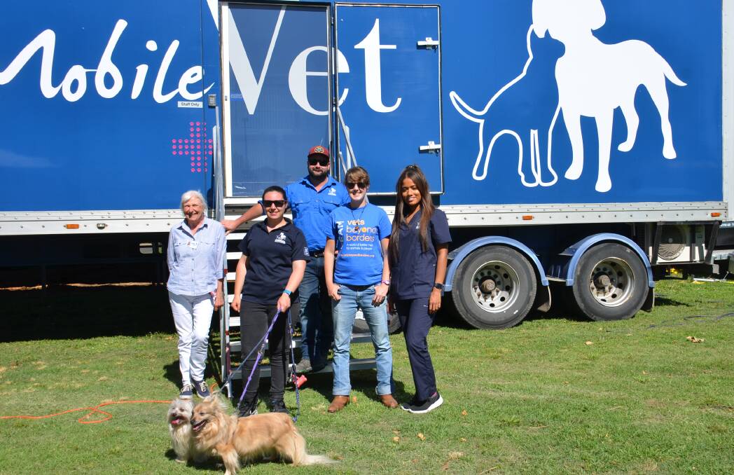 Animal Welfare League Armidale chapter acting secretary Margaret Sadler with the team from the mobile vet truck Jade Tavaies, Katie Breckenridge, Dan Naetheys, Emma Gatt and patients Jonty and Monte at the Armidale showground yesterday.
