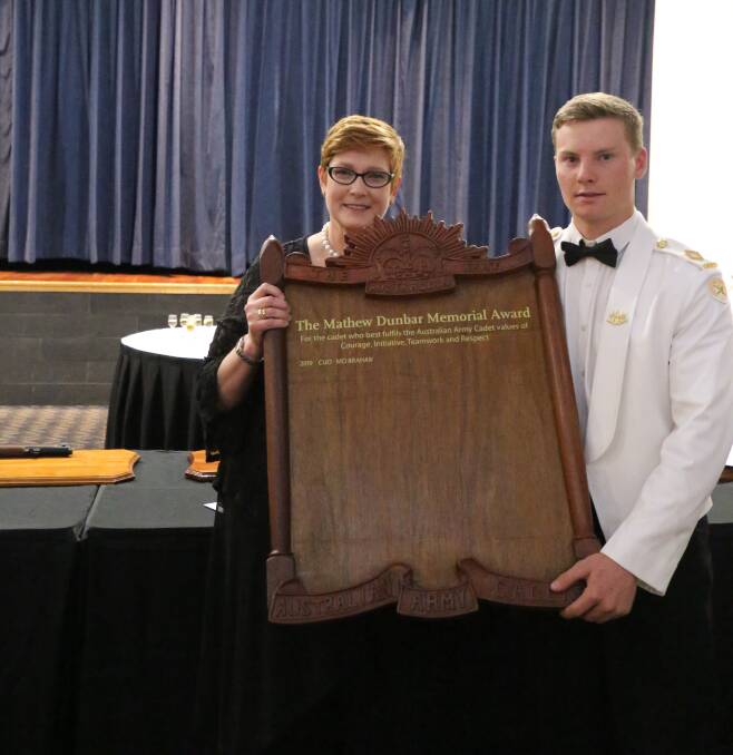 Minister for Foreign Affairs and Minister for Women Senator the Hon Marise Payne presents the inaugural Mathew Dunbar Memorial Award to Marcus Braham.