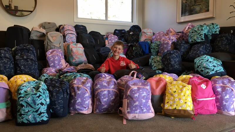 AMATEUR ALTRUIST: Simon Wellings with his Just 4U Backpacks last year. Photo: supplied.