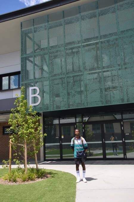 Sport Captain Tanaka Marume stands outside Building B which houses the year 12 neighbourhood and student support service centre. Photo: Vanessa Arundale