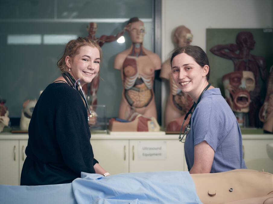 Jess Chambers, left, and Sarah Appleby in the Tablelands Clinical School medical
simulation room in Armidale.