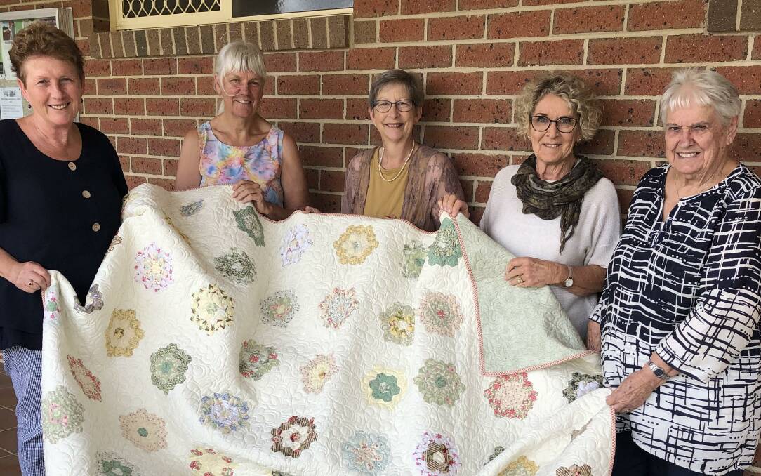 PATCHWORK PRINCESSES: Kenny Richards, Judy Docksey, Annette Hourigan, Robyn Wood and Marg Schaefer with the 2022 quilt prize. Picture: supplied.