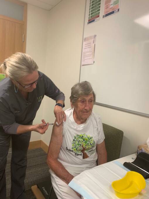 TREND SETTER: Susan Barry receives her Astra Zeneca vaccination from nurse Tanya Alcorn at the UNE Medical Centre. Photos supplied.