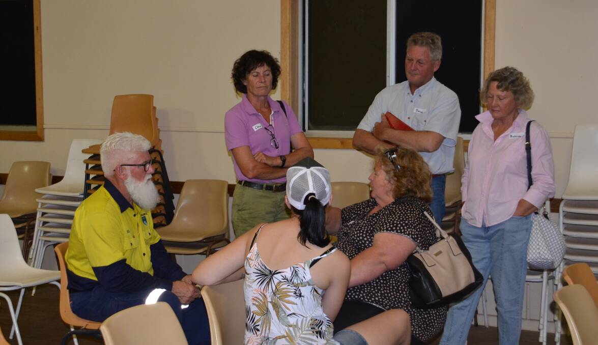 FRIENDLY FACILITATOR: Walcha Council OH&S officer Noel O'Brien speaks with some of the fire affected residents at the recent Yarrowitch BlazeAid Camp meeting