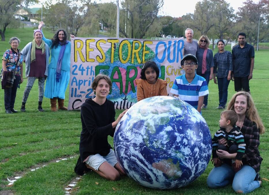 It's all about the Earth ... and how we leave it to young people such as Hamish Westhorpe, Angelin and Aben Dennis, and Harry Ashman. Lending their support are Amy Ashman, Maxine Ross, Annette Kilarr, Maria Rummery, Mary and Doug Westhorpe, Jessy George and Dennis Eappon.