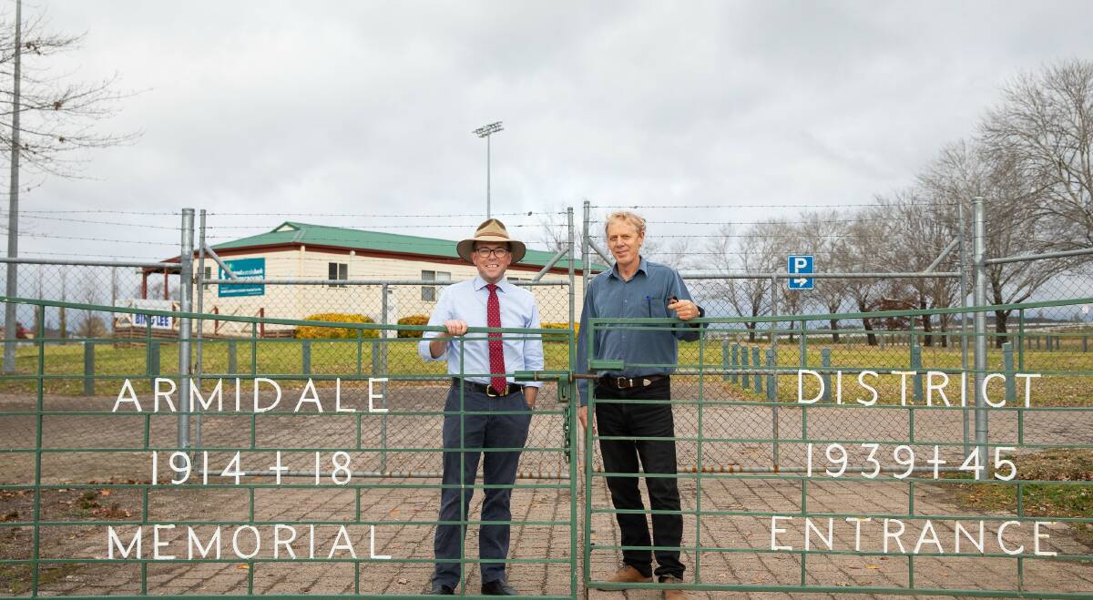 LOCKED IN: The War Memorial gates at Armidale Sportsground will undergo a $2,552 revamp this year, with Northern Tablelands MP Adam Marshall, left, and Armidale Regional Council Co-ordinator Public and Town Spaces Richard Morsley. Photo supplied.