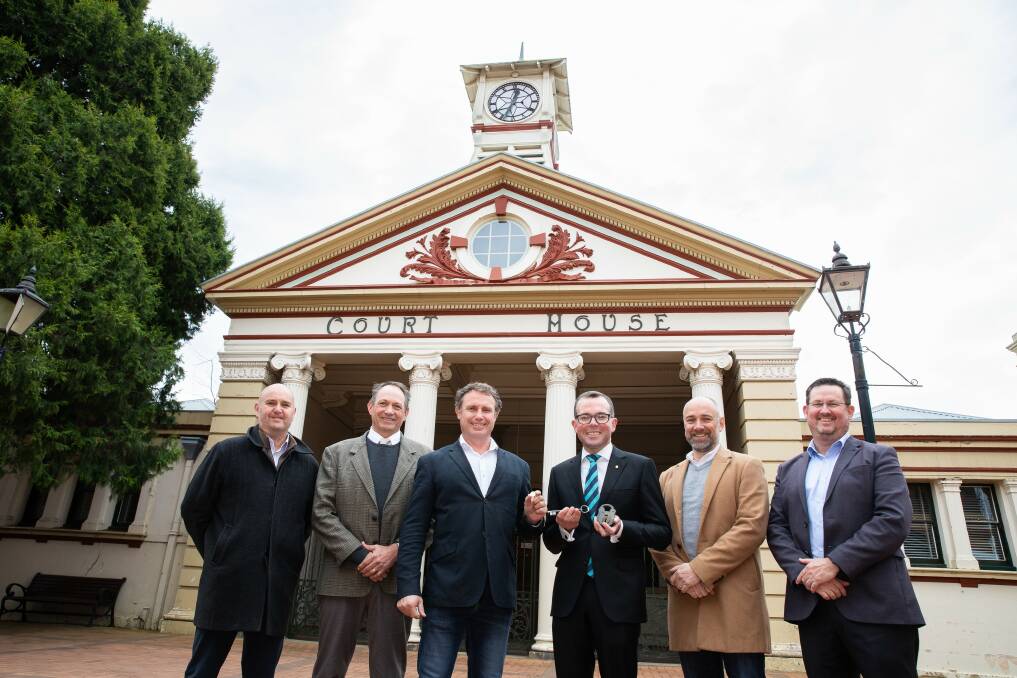SOLD: Celebrating the re-birth of Armidales oldest public building today, with State Heritage listing and new owners, Armidale Regional Council General Manager James Roncon, left, Councillor Paul Packham, Mayor Sam Coupland, Northern Tablelands MP Adam Marshall, Deputy Mayor Todd Redwood and Councillor Paul Gaddes. Picture: supplied.