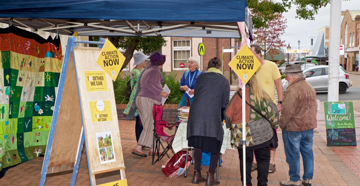 TAKING IT TO THE STREETS: Conversations with locals and visitors at the Climate Action Now stall: . Picture: Dave Robinson.
