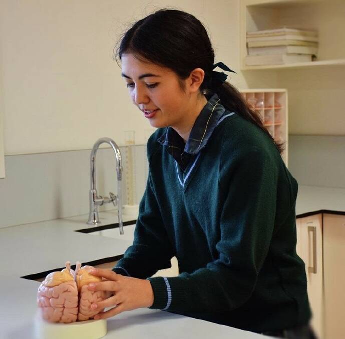 STEM STAR: Chiyo Brown in the laboratory at PLC Armidale. Photo supplied.