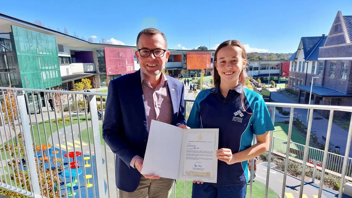 Northern Tablelands MP Adam Marshall, left, presented Armidale Secondary College Year 10 student Sophia-Rose Markham with a certificate today, recognising her selection as one of only 20 recipients across the State of the 2022 Premier's ANZAC Memorial Scholarship.