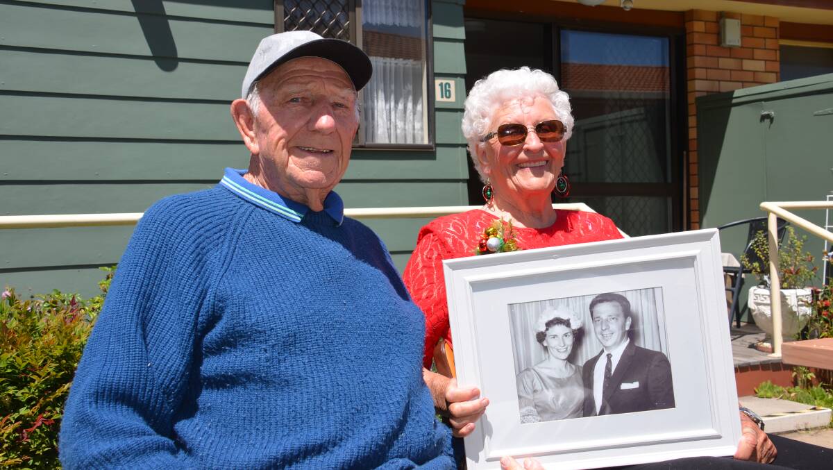 A PAIR OF DIAMONDS: Ernie and Mollie Askew on their 60th wedding anniversary with a photo from their wedding day.