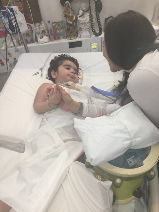 Founder of the GBS Foundation of Australia Jade Parsons with GBS paralytic 3-year-old Charbel in Sydney Children's Hospital.  He is one of the patients who will be trialling the Neuro Node, so that he can communicate with his family and medical staff.