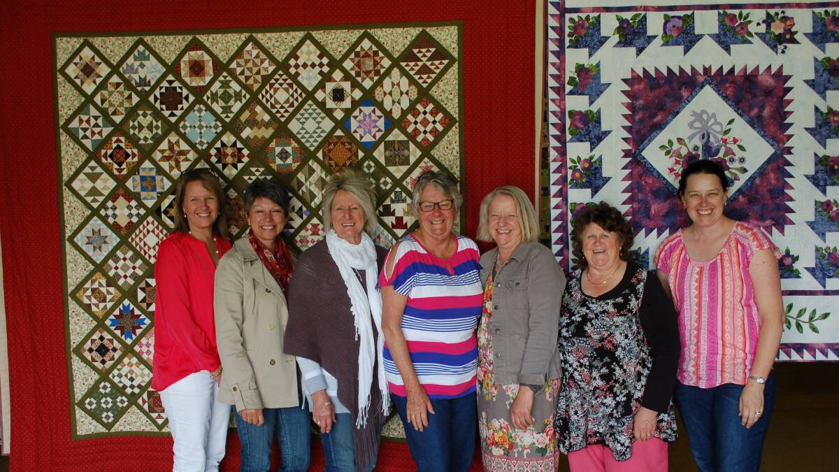 CHARM PACK: The Quilt exhibition in the Langford Woolshed is run by the local quilters pictured and  is always spectacular with more than 100 quilts on display.
