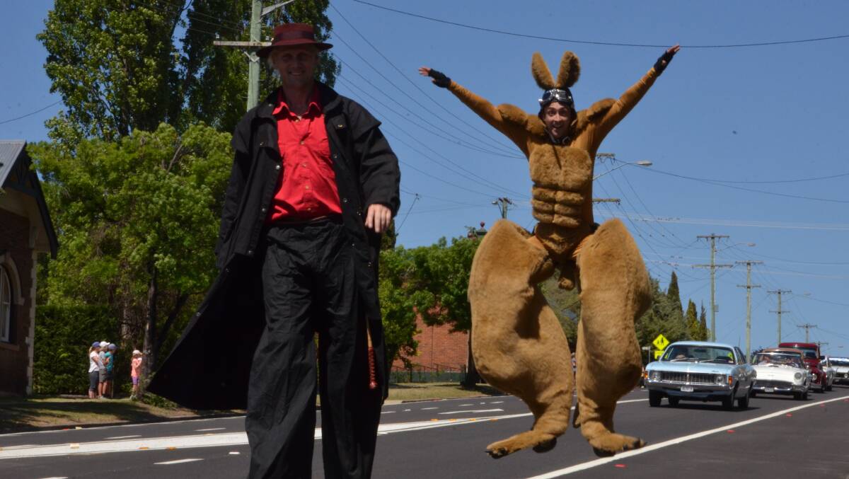 JUMPING FOR JOY: Circus performers and stilt walkers are always a popular feature of the annual Thunderbolts Festival street parade in Uralla, along with the vintage cars.