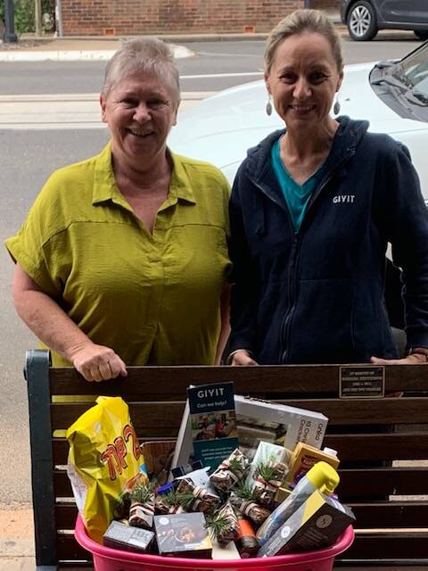 Susan Manttan from Armidale Family Support Services with Melissa Bowman from GIVIT last week. GIVIT purchased hand made brownies from local caterer, Laura Swan from Swan Fine Foods to go in the hampers being distributed to those in need.