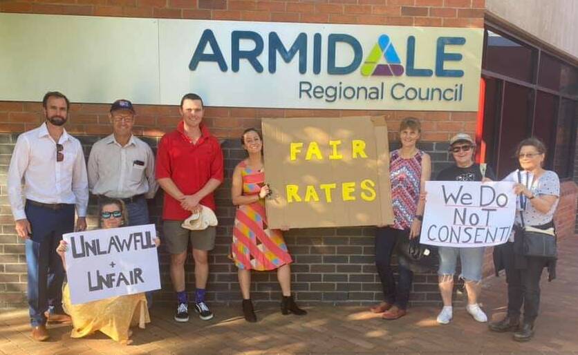 Joshua Fittler (in red) with other concerned residents outside Armidale Regional Council on Wednesday