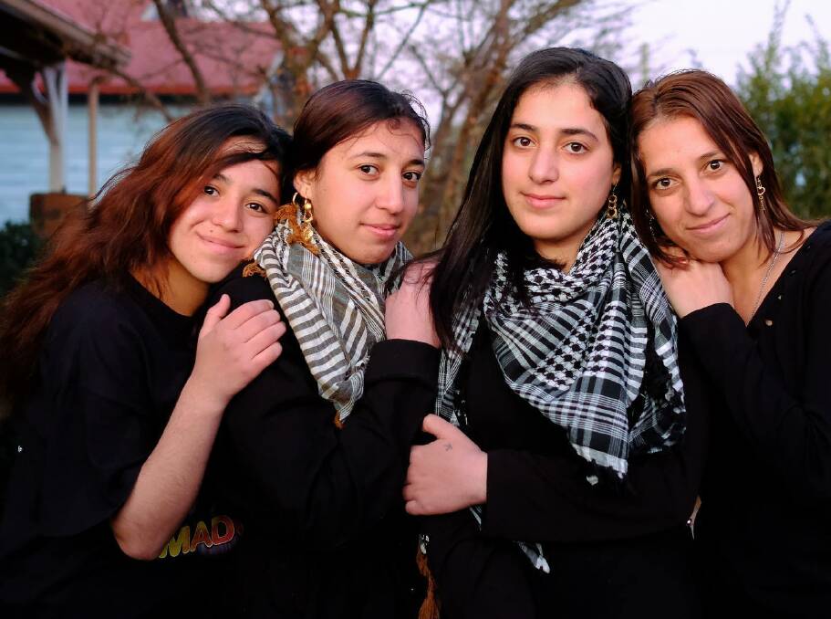 FACES OF THE FUTURE: Some of the faces of the Armidale Ezidi community from the photographic project 'Year of Welcome' by Simon Scott. Photo supplied.