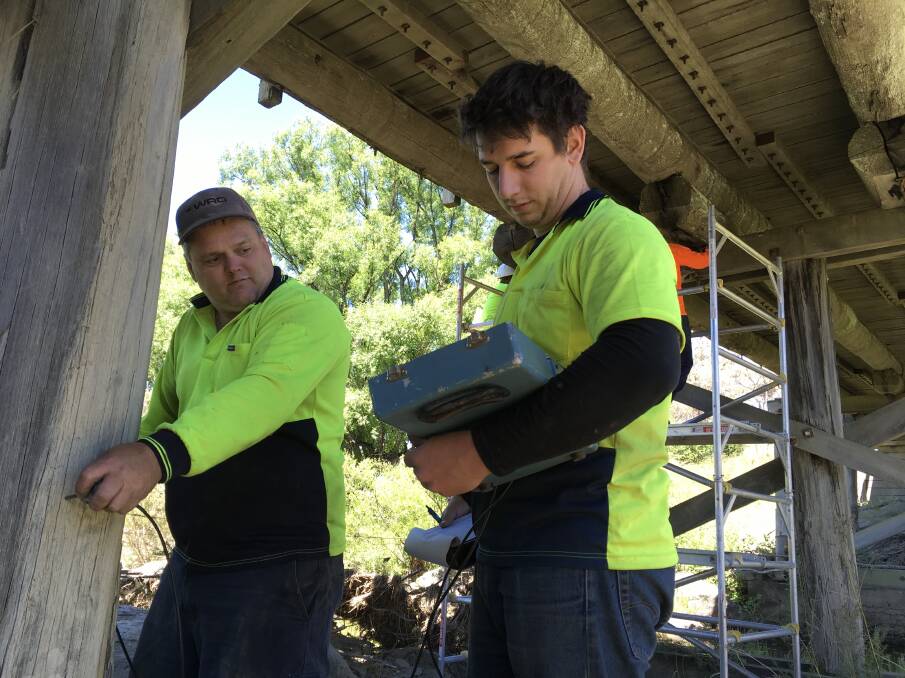 Contractors testing the structural integrity of a timber bridge for Armidale Regional Council.