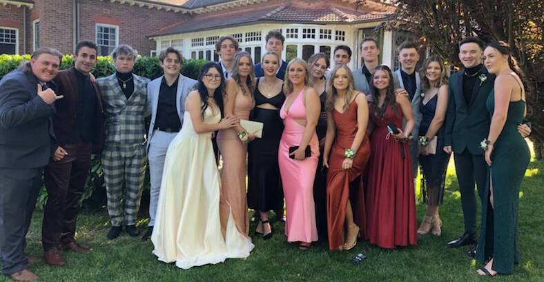 SCHOOL'S OUT: The best accessories were the smiles and good humour as the graduates celebrated with their class mates. Picture: supplied.