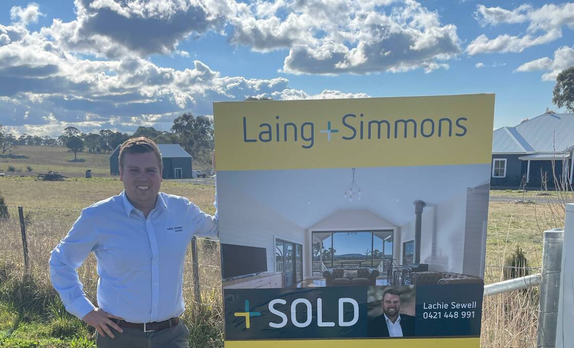 SOLD: Lachie Sewell of Laing+Simmons Armidale at the $2million property. Photo: supplied.
