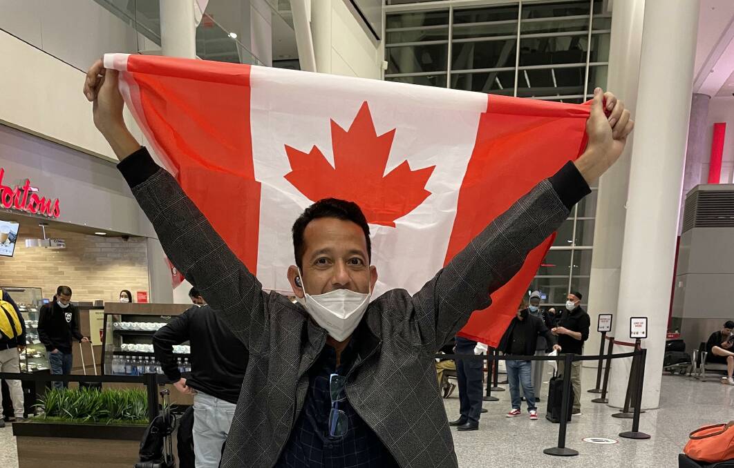 NEW BEGINNINGS: Myo said he wanted to kiss the Canadian flag as soon as he got off the plane in Toronto. Picture: supplied.