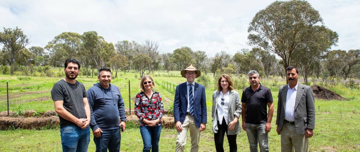 Northern Settlement Services' Project Officer Khalid Adi, left, Hadi Ildnidnii, Northern Settlement Services' CEO Sharon Daishe, Northern Tablelands MP Adam Marshall, Northern Settlement Services' Community and Settlement Co-ordinator Jessica Schmidt, Hamoud Afret and Saeed Suliieman.Picture: supplied.