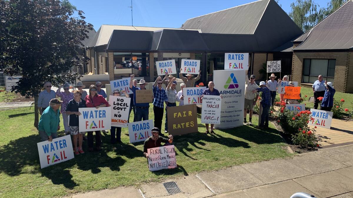 Residents begin to gather outside the Guyra council chambers on Wednesday afternoon