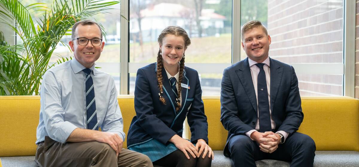 Armidale Secondary College Year 10 student Nicole Tarrant, centre, has been appointed to the Education Ministers inaugural NSW Student Council. Nicole is congratulated on her appointment by Northern Tablelands MP Adam Marshall, left, and Acting Principal Scott Breen.