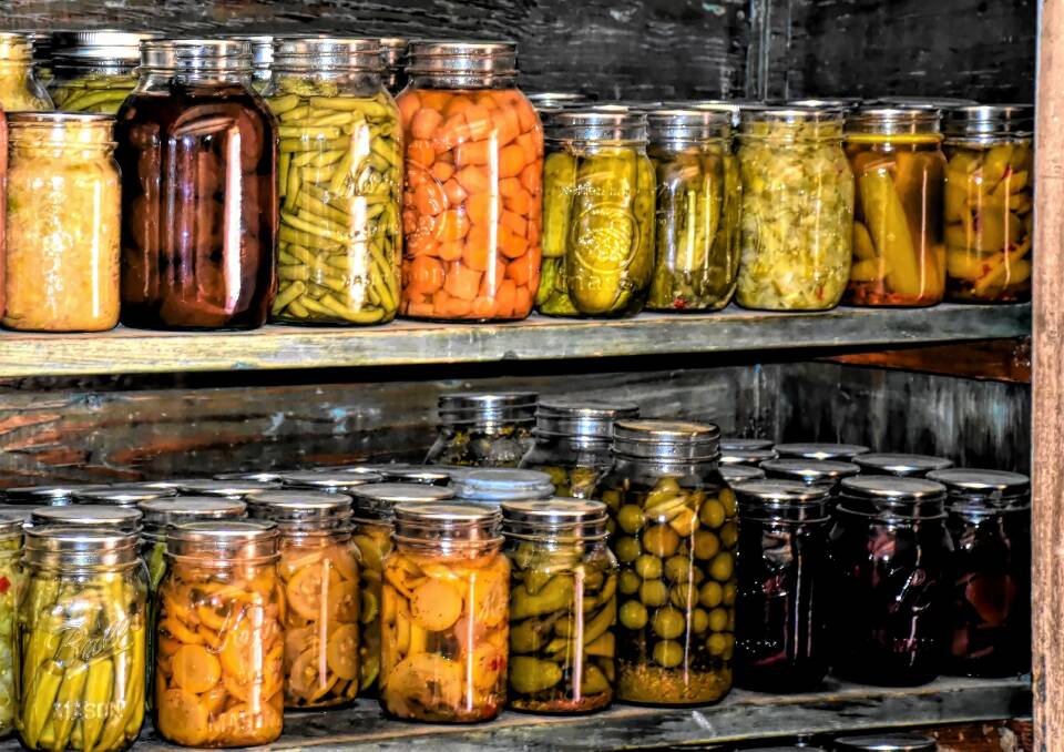SUMMER IN A BOTTLE: A variety of preserved vegetables including tomatoes, okra, carrots, cucumbers, olives and beetroot. Stored in a cool, dark place to maximise their shelf life. Picture: supplied.