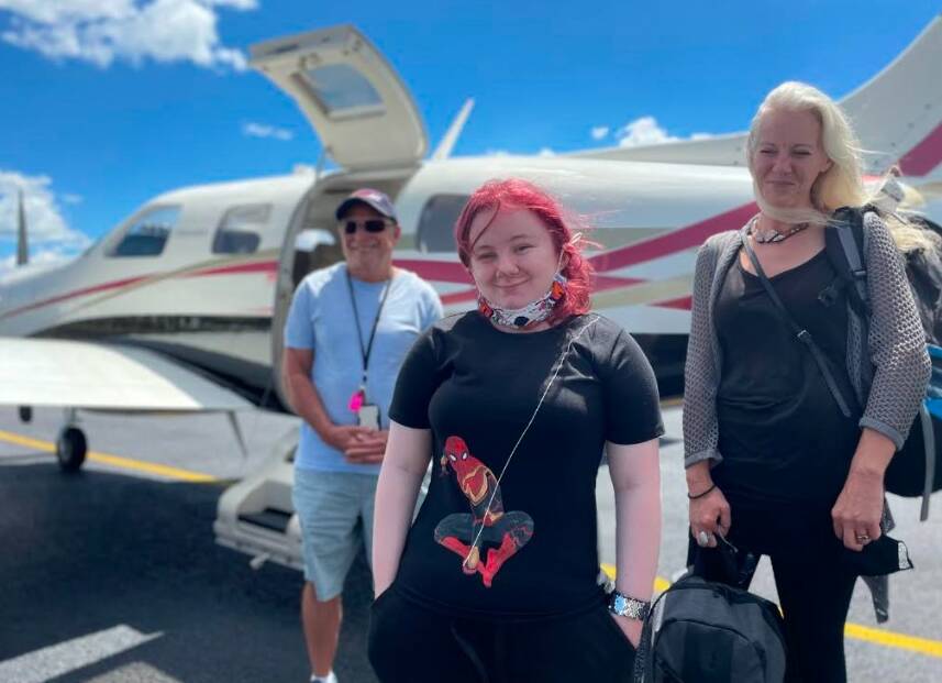 SHE'S A SURVIVOR: Lotus Walker with her mum Sarah and Angel Flight volunteer pilot Tony Wheeler. Picture: Vanessa Arundale.