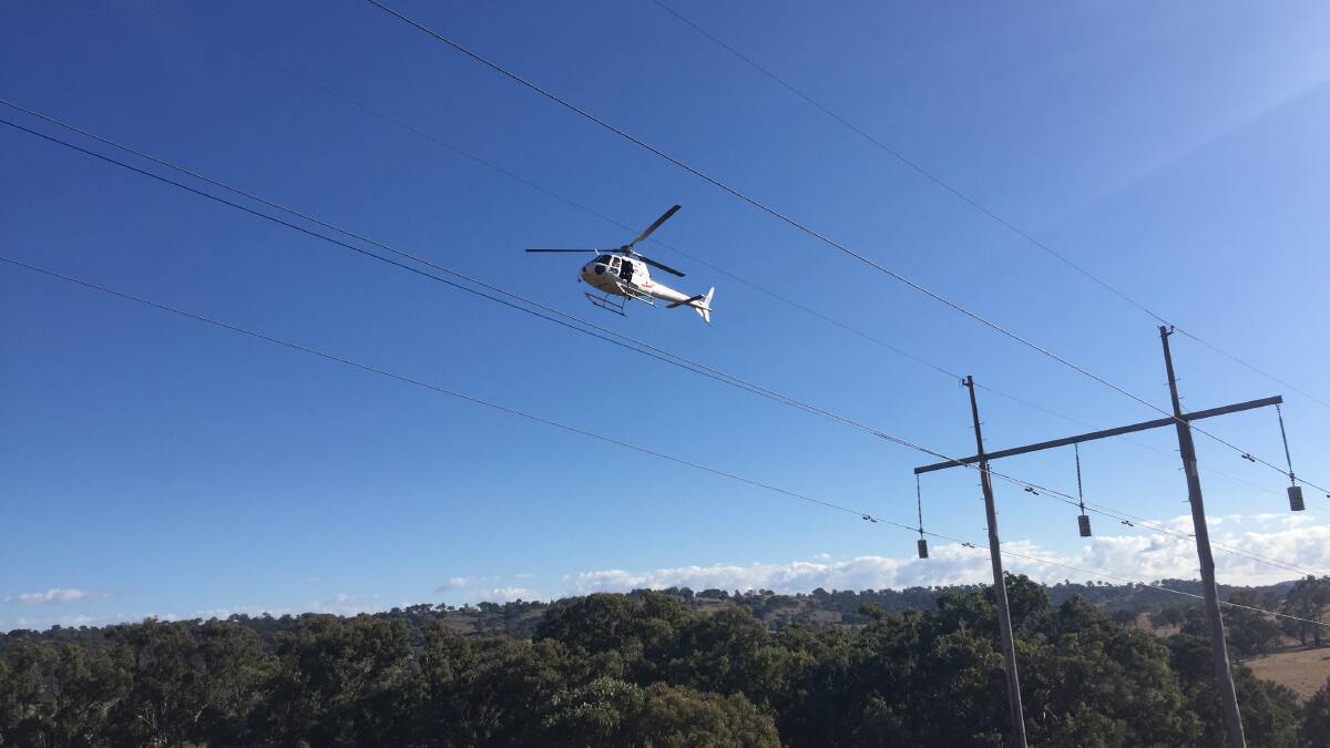 Don't panic if you see a helicopter flying near powerlines