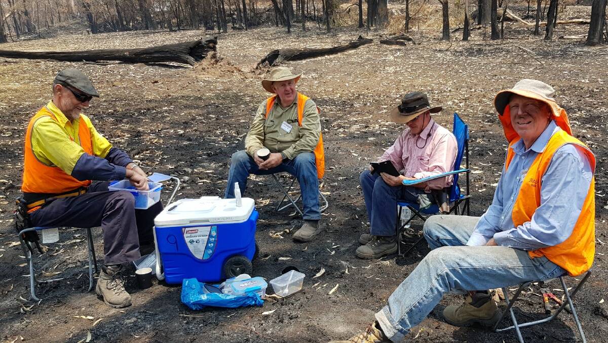SALT OF THE EARTH: BlazeAid volunteers enjoy a well earned morning break while working on the property of Malcolm and June Ross at Ebor