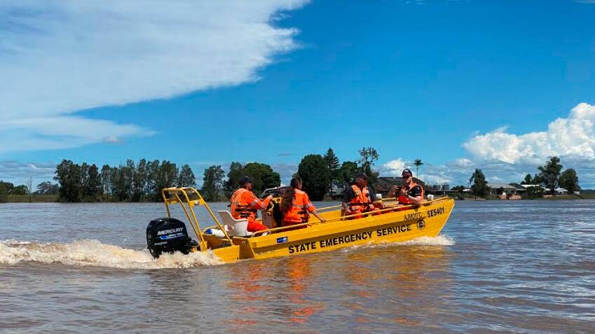 HERE TO HELP: The SES crew on the swollen Clarence River in Grafton this week. Picture: supplied.