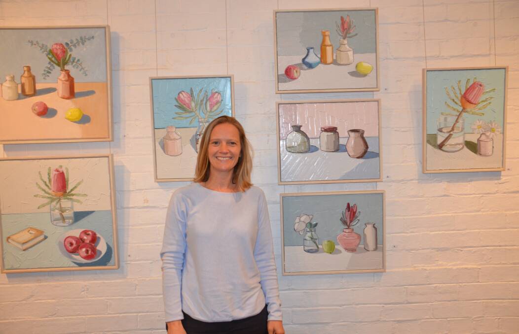 Esther Eckley in front of her current exhibition