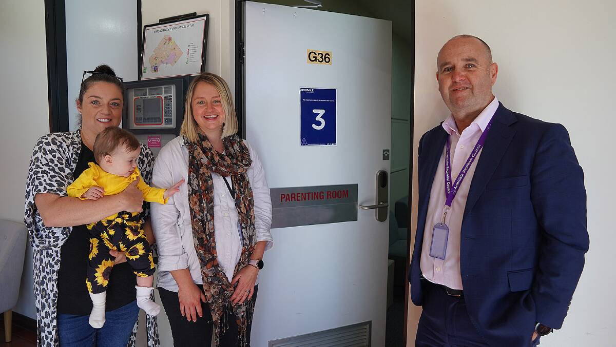 IT'S ONLY NATURAL: Armidale Regional Council sport and recreation development officer Amy Biggs with daughter Laila, project officer Alesya Frost and general manager James Roncon at the new parenting room located in the Armidale Civic Administration Building. Picture: supplied.