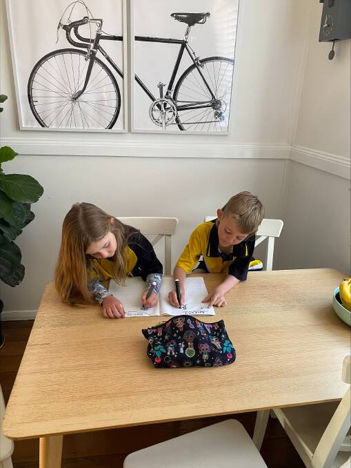 Twins Romy and Hudson, 8, get started on their mascot designs for honesty as part of the Kind Kids Design a Mascot competition. Scan the QR code to enter. Picture supplied