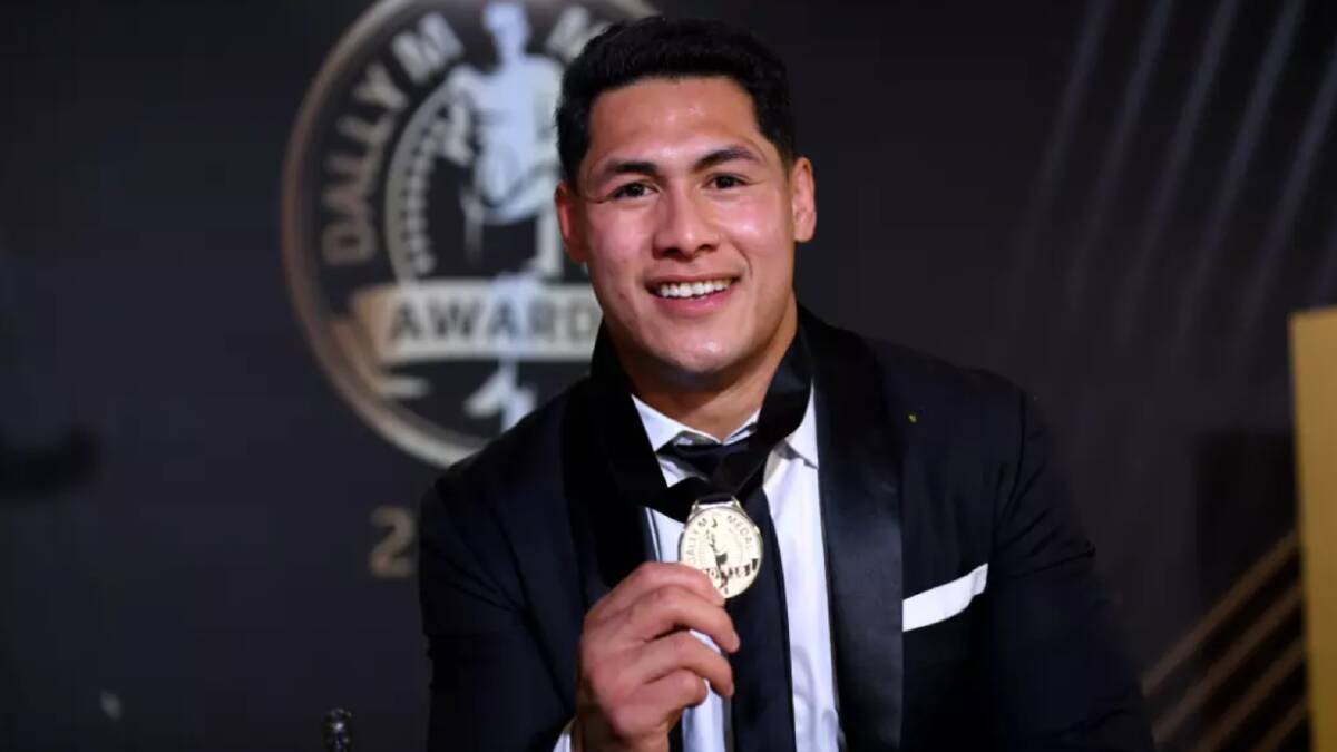 "I feel truly blessed to be holding this trophy": Warriors captain Roger Tuivasa-Sheck. Photo: AAP