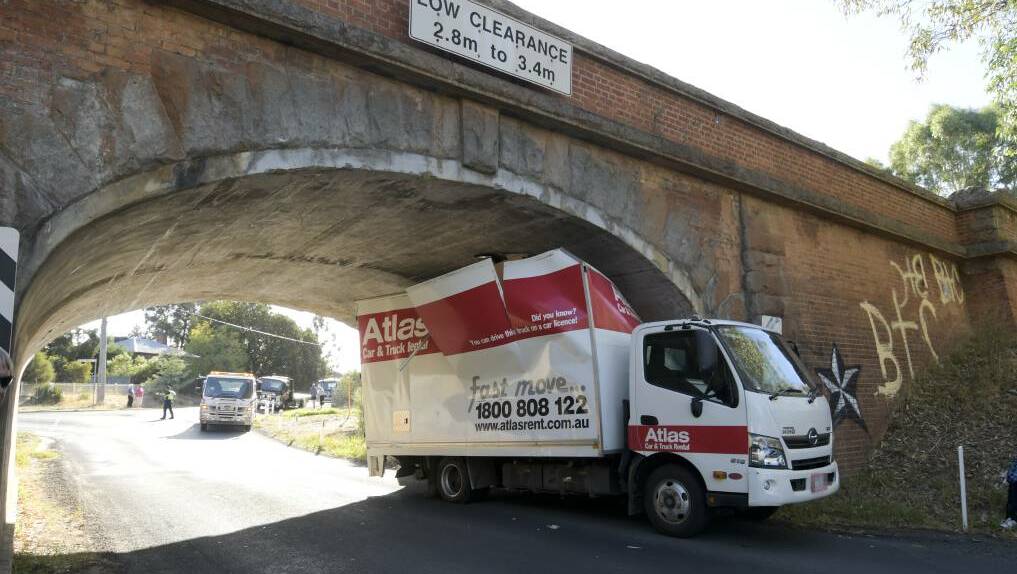 Another day, another truck stuck under a bridge. Photo: Noni Hyett, Bendigo Advertiser
