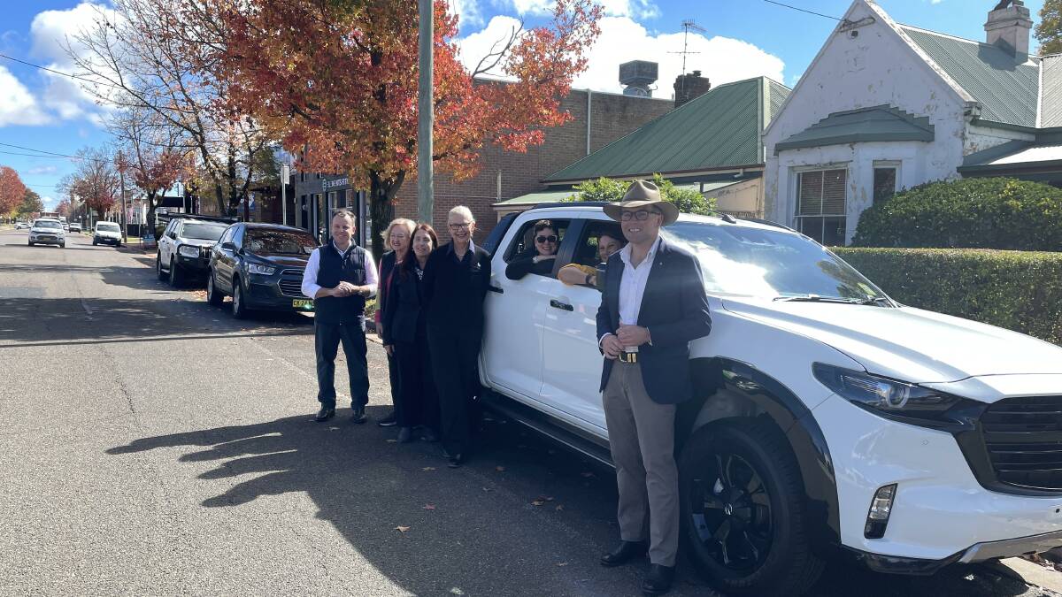 Northern Tablelands MP Adam Marshall with New England Family Support Service chair Margaret Sims, general manager Anne Rix, Neighbourhood Centre coordinator and RFS peer support worker, Jaz Taylor and family support staff with their new set of wheels.